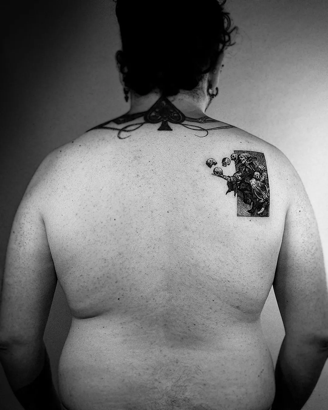 Wider view of the jester woodcut back piece