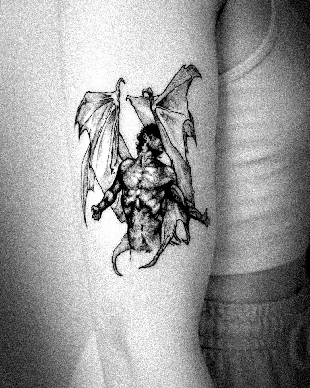 Detail of the winged demon engraving tattoo